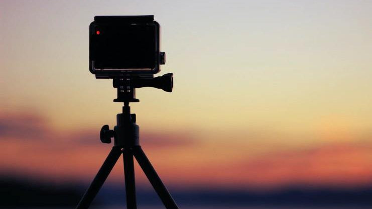 Action camera mounted on a mini tripod